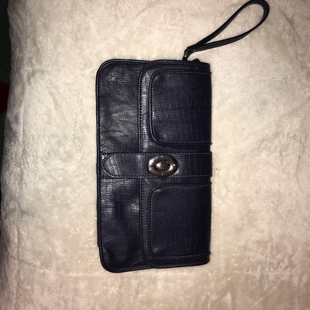 Wristlet. Between navy blue and purple.